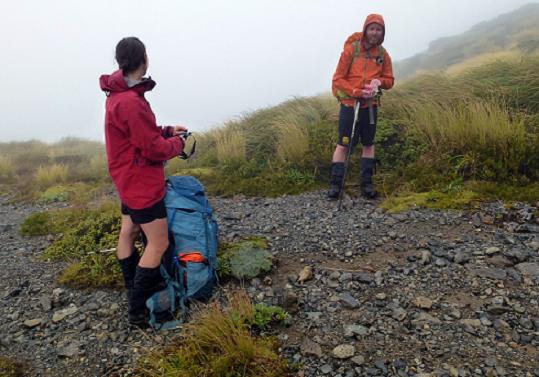Snack break in the clag on the way up Mitre Peak