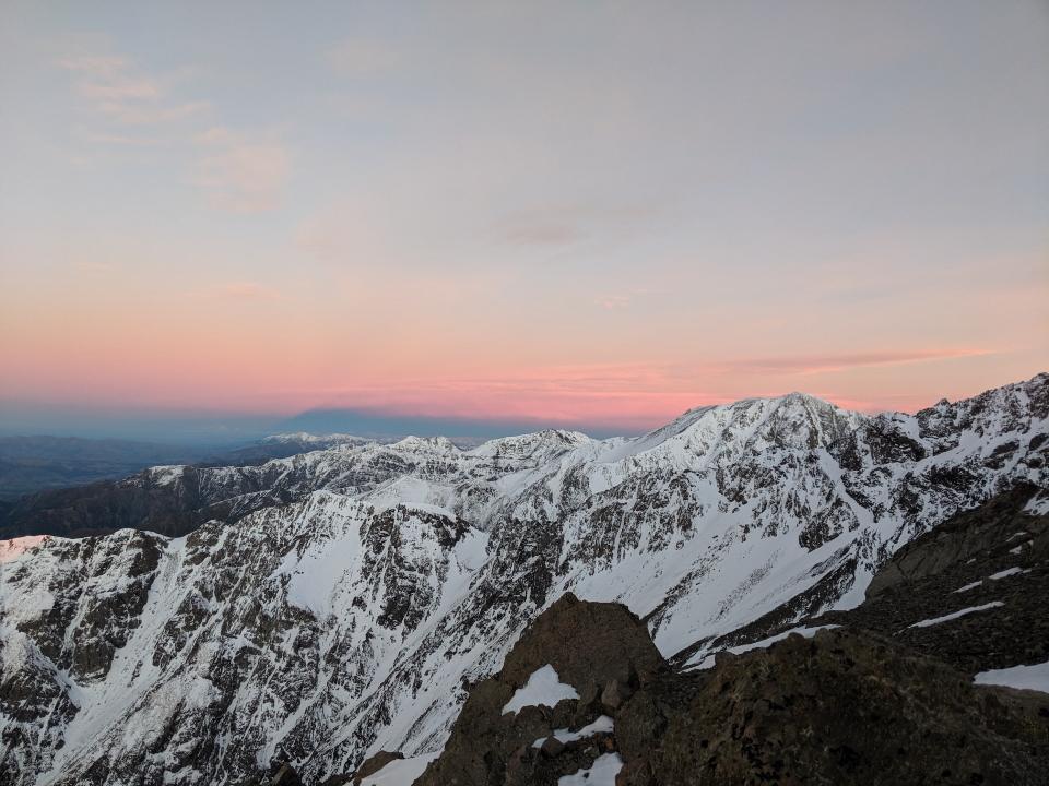 Sunrise over snow covered mountains