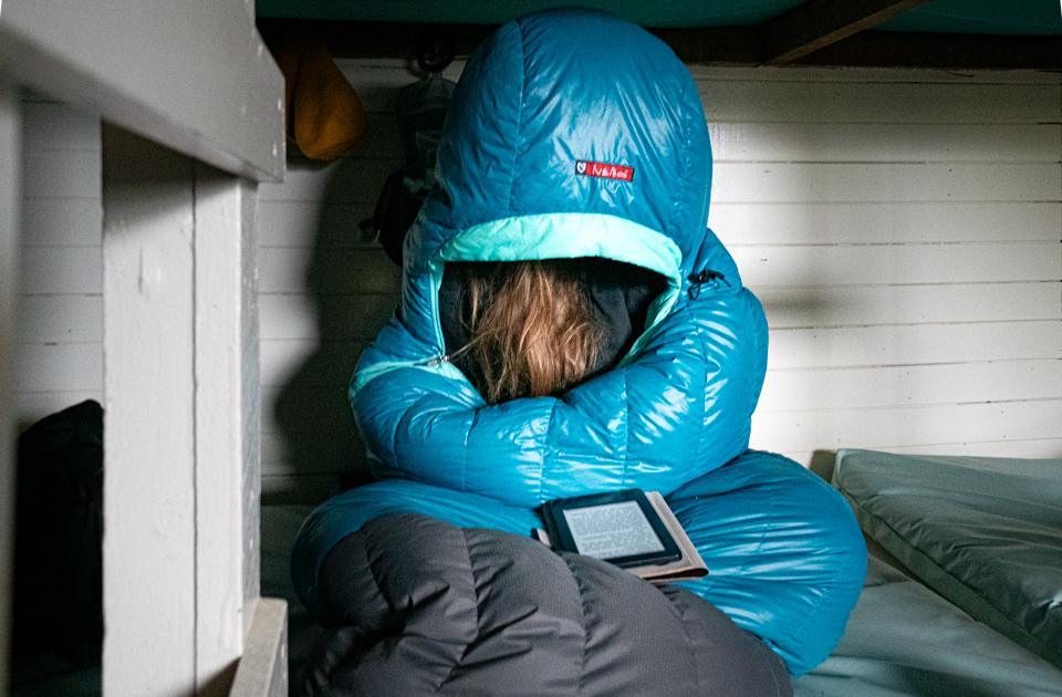 Relaxing inside Gosling Hut while the rain drummed on the roof