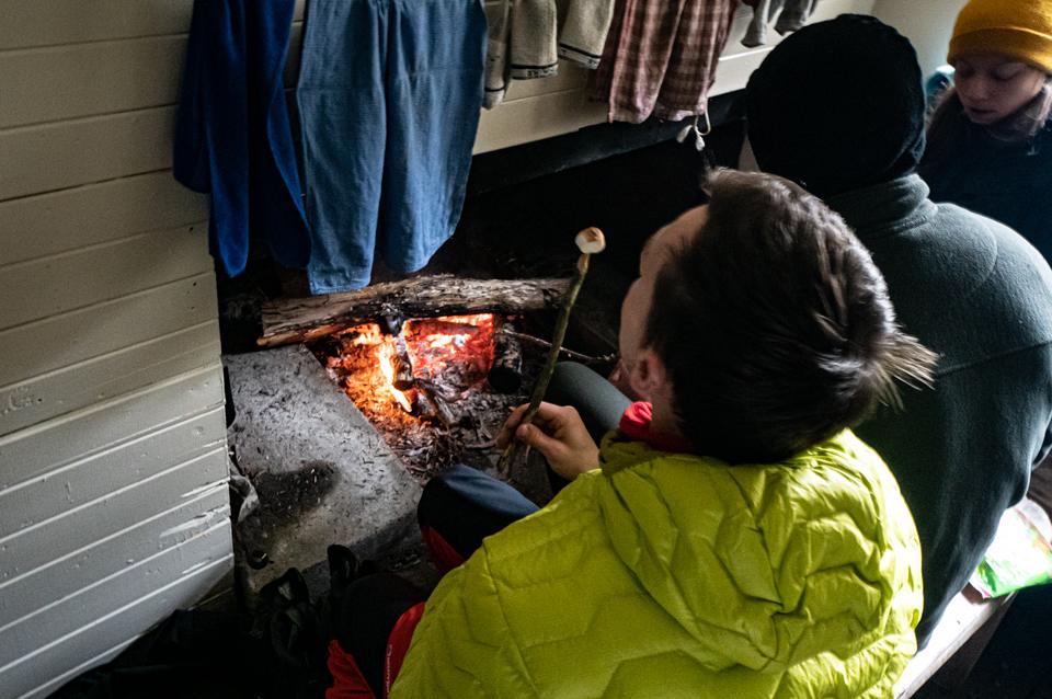 Toasting marshmallows on the fire at Gosling Hut