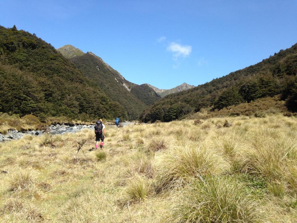 Trampers walking next to Kawhatau River