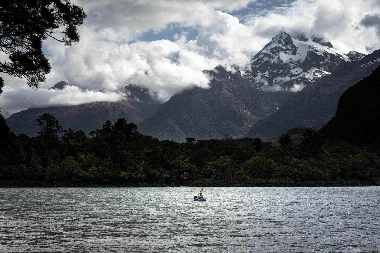 Nearing the end of Lake Alabaster with evening view of the Darran Mountains