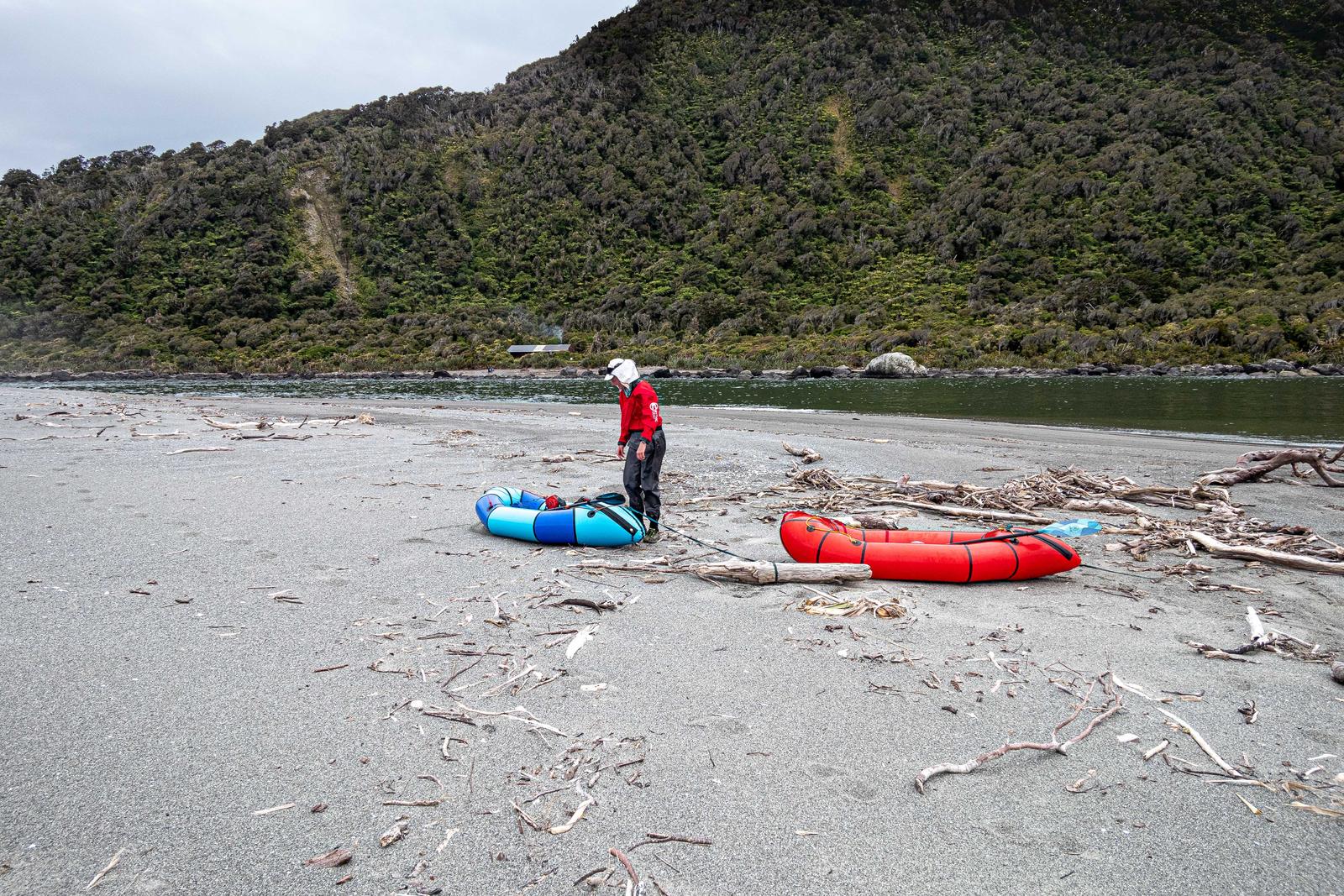 On the sandbar at Martins Bay Fiordland National Park - Martins Bay Hut behind