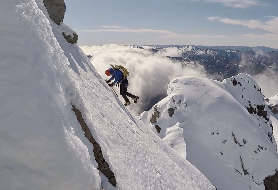 Elisabet navigates the exposed horizontal traverse just before the final climb to the High Peak of Mt Rolleston