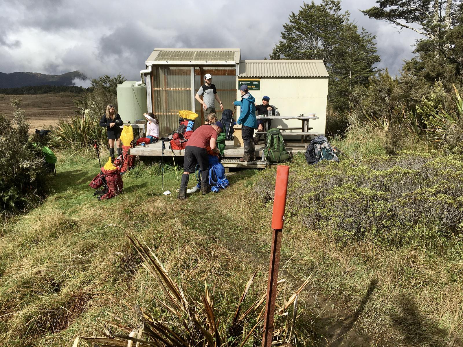 Six trampers at a hut