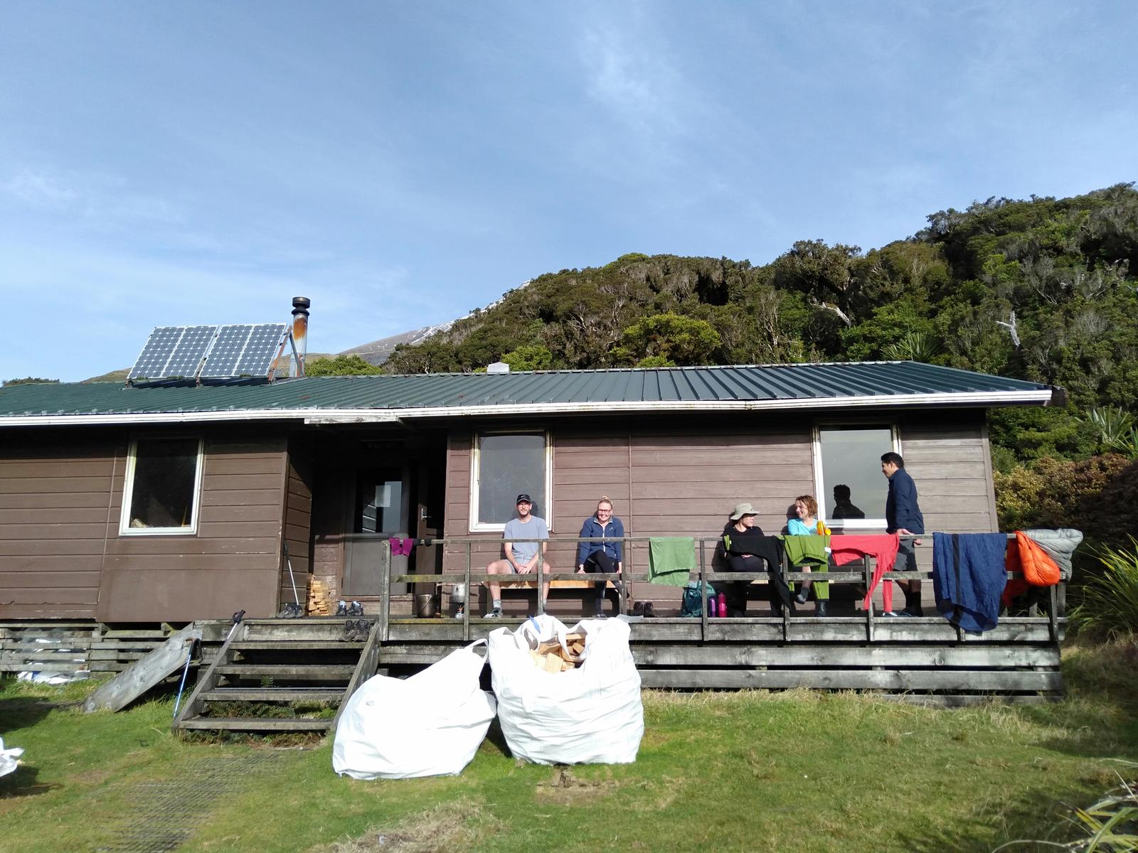 Group sitting outside Holly Hut