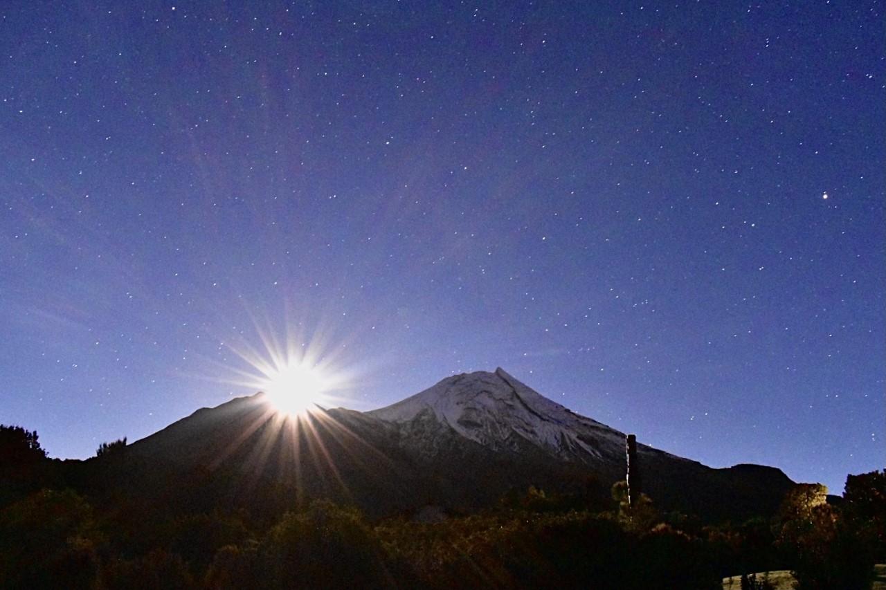Sun over Taranaki Maunga