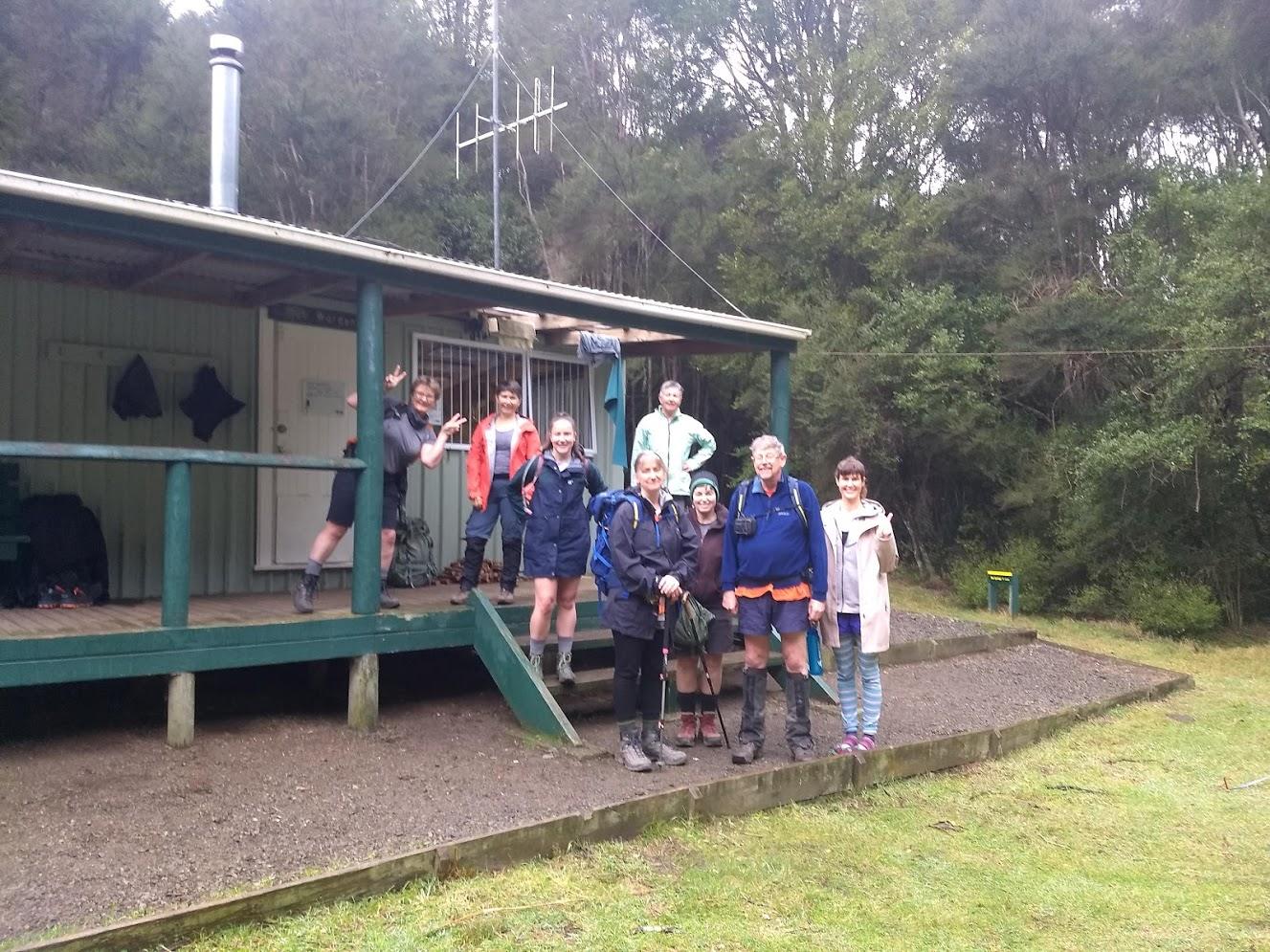 Trampers outside a hut