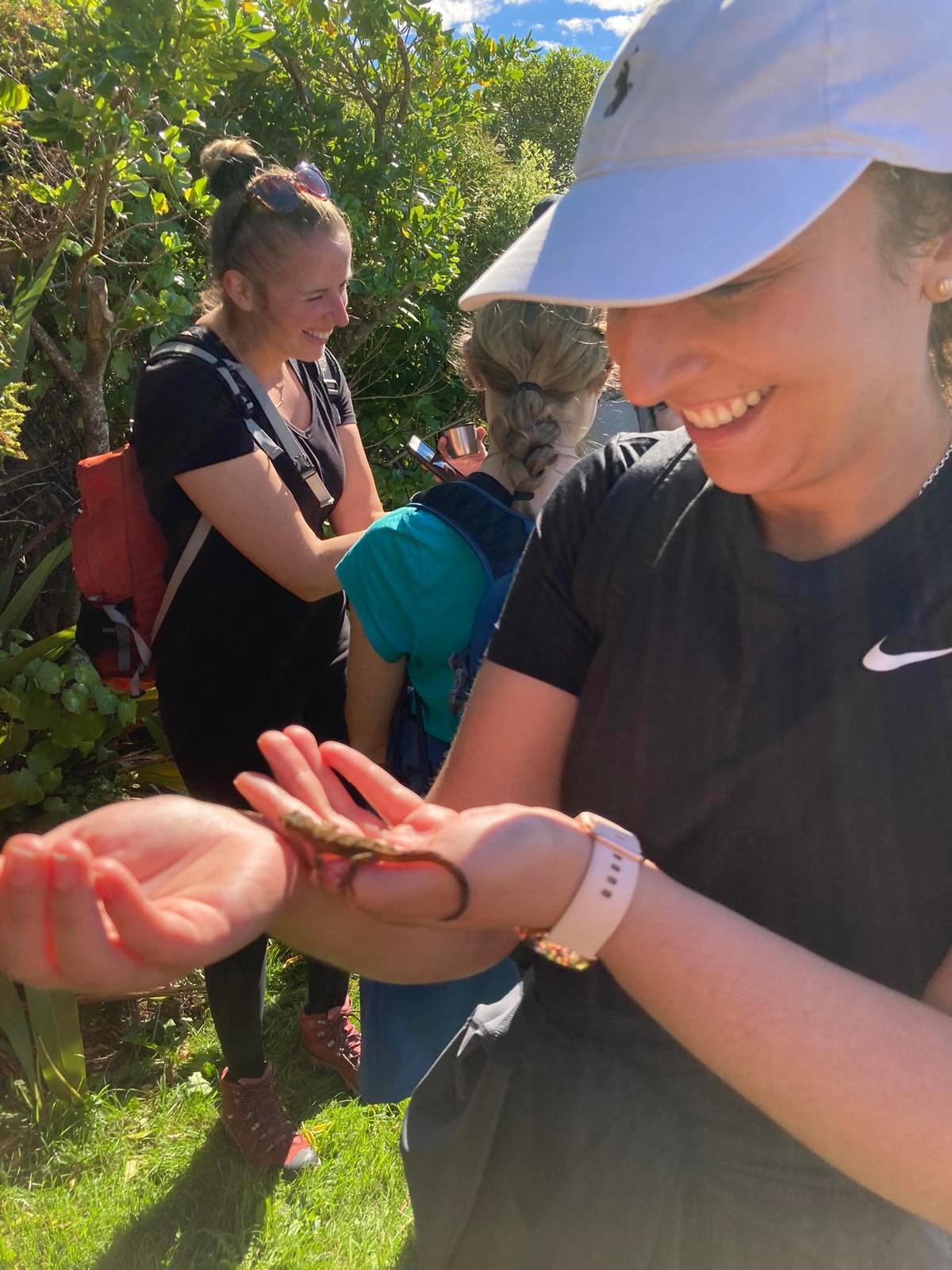 Holding a raukawa gecko.