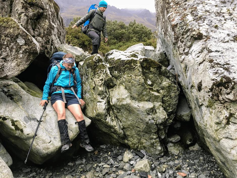 Bum sliding down smooth rocks