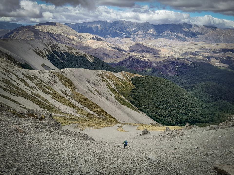 Descending scree slopes towards the Camp Saddle Track