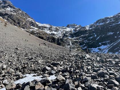 Team WTMC descending the scree with the daunting bluffs leading to the upper Hopeless Basin (Photo credit: Emily)