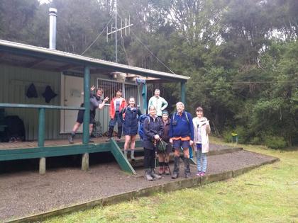 Trampers outside a hut