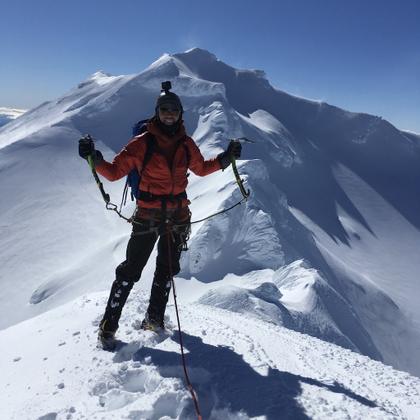 Nick on the summit of Girdlestone Peak, with the impressive Tahurangi traverse behind