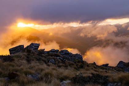 Fiery sunset on the ridge towards Mt Fell. (Photo credit: Lynsey).