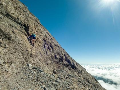 Aimee climbing a step in the ridge