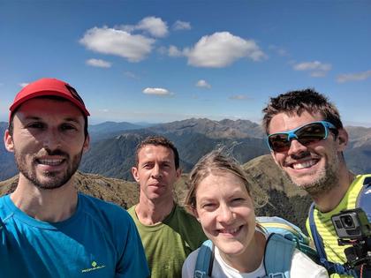 Team braving some confident smiles on top of Mount Crawford