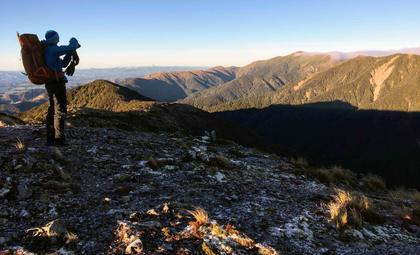 Man taking a photo in Ruahine Ranges