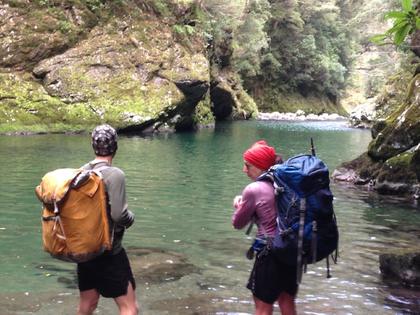 Trampers standing in a river