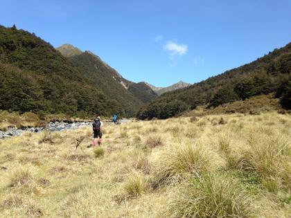 Trampers walking next to Kawhatau River