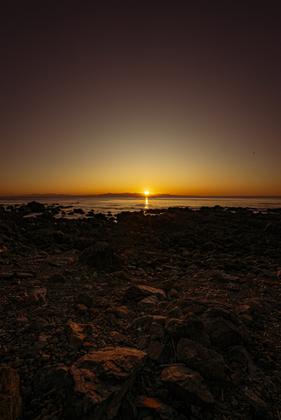 Makara Walkway - sun setting over South Island
