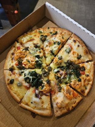 Delicious Salmon and capers pizza from the Alpine Lodge (Credit: Sara)