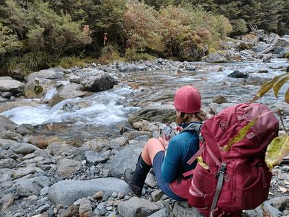 Emily has some morning tea at the crossing of Mistake Creek.