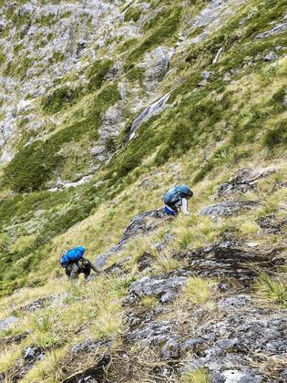 Sidling up the slopes beside the waterfall