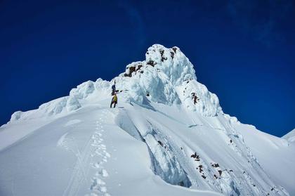 Nick brings Elisabet up to the anchor at the base of First Pinnacle before setting off for the final summit (credit Gareth)