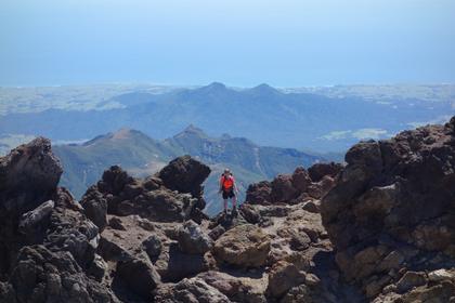 Tramper on top of Mt Taranaki