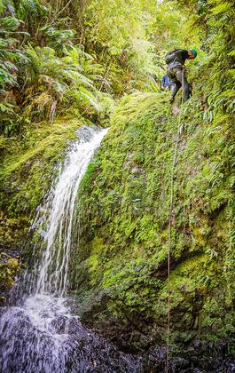 Rappelling one of the smaller waterfalls Eager Beaver Canyon