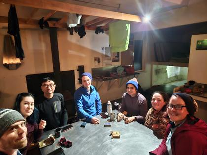 EM and M groups playing cards. [Photo Credit – Sara]