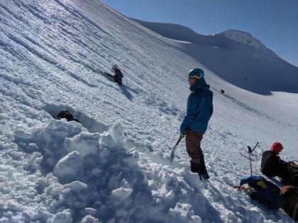 People digging tunnels in the snow at Mt Ruapehu