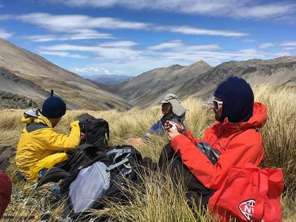 Saturday lunch at the head of the valley just before re-joining the Two Thumb Range. Photo credit: Emily.