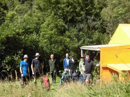 8 Trampers and 5 stoves (not visible) at Stanfield Hut