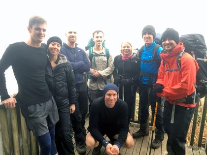 Trampers standing on a deck
