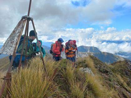 Photo credit: Jamie. Navigation skills in action at the top of Te Atuaoparapara.