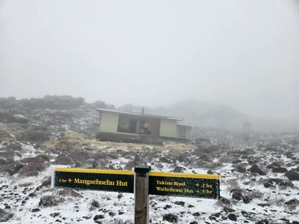 Getting ready to go at 8am and must have been -2 deg!! Sign in front of Rangipo Hut with recently fallen snow.