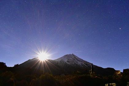 Sun over Taranaki Maunga