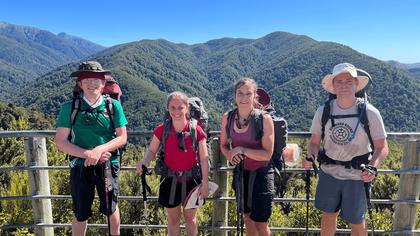 Standing in front of the rocky mountain lookout