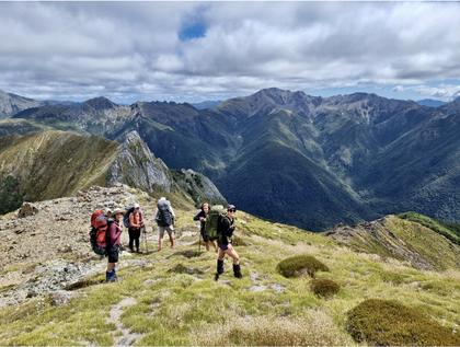 Relief at finding grass after climbing up scree