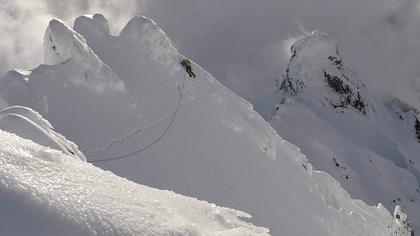 Elisabet climbing through the second crux of the route – a steep down climb around the summit off First Pinnacle