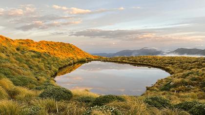 Looking north from Maungahuka Hut at sun rise. Mt Holdsworth and Isabelle are on the right