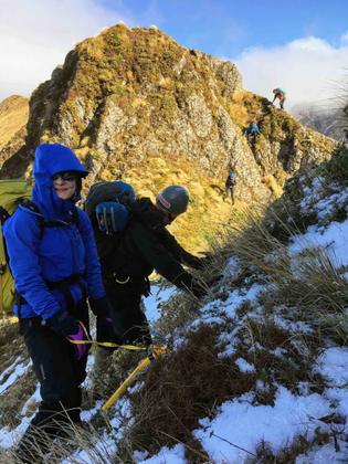 Trampers on a snow covered ridge