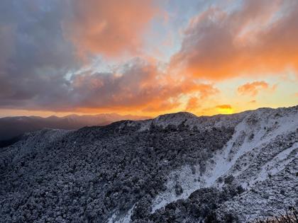 Fiery sunset from Powell Hut helipad looking towards Mt Hector. (Credit: Emily)