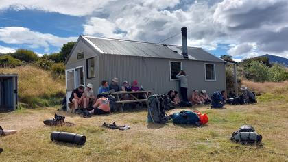 Hiding from the sun, WTMC in the left of the photo with UC students on the right [Rory]