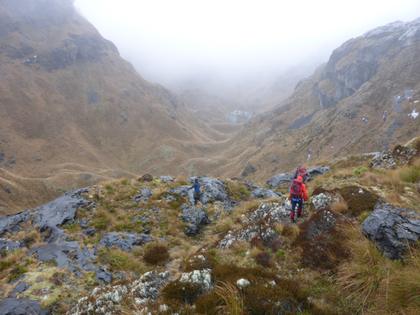 In Castle Basin on the way to the ice-cave in wet and windy weather. We turned back here.