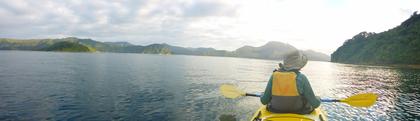 View of a kayaker on open water
