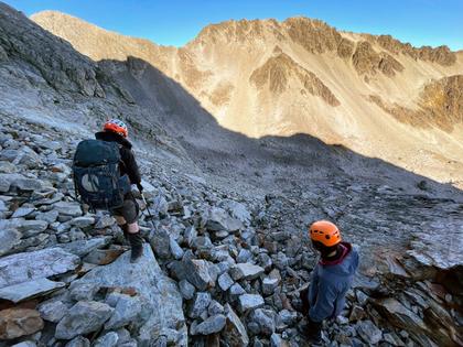 Looking across at the Col (the lowest point on the ridgeline – slightly left of centre of the shot) we have to climb back up to. (Photo credit: Emily).