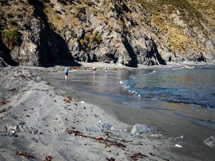 A stretch of sandy beach that may become difficult at high tide